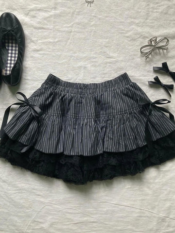 Designed slim camisole + high-waisted striped patchwork skirt