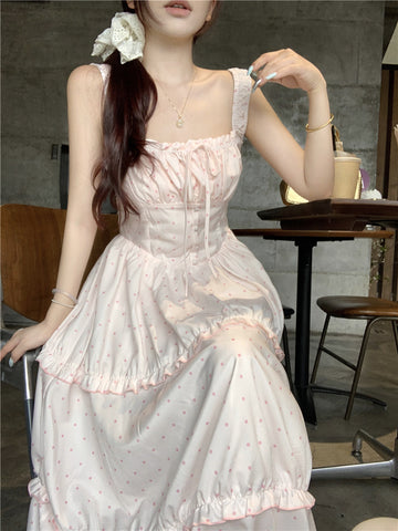 Women's pink polka dot suspender dress