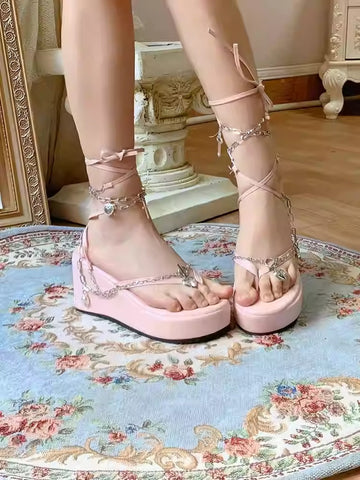 Pink strappy slippers